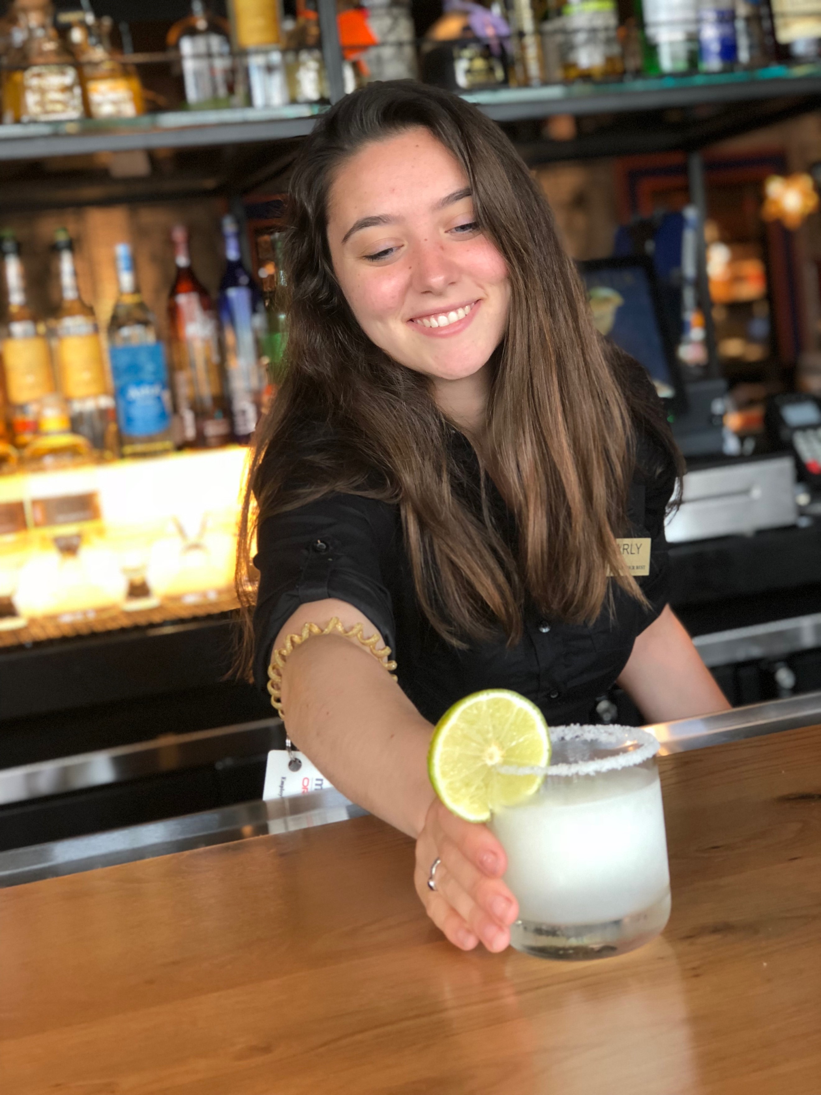 Employee preparing a drink at the Blue Delia restaurant